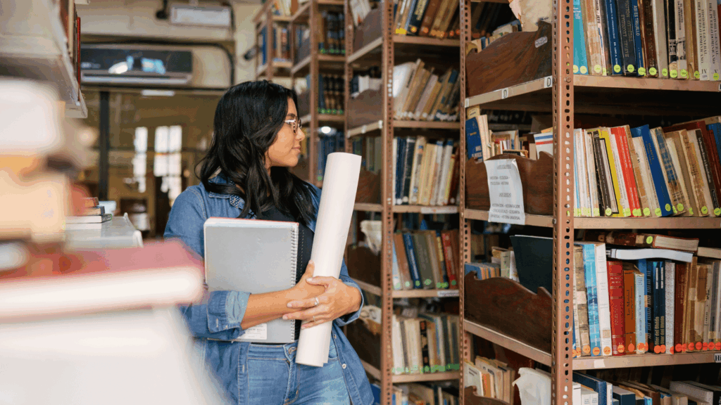 young woman using her travel & research award
